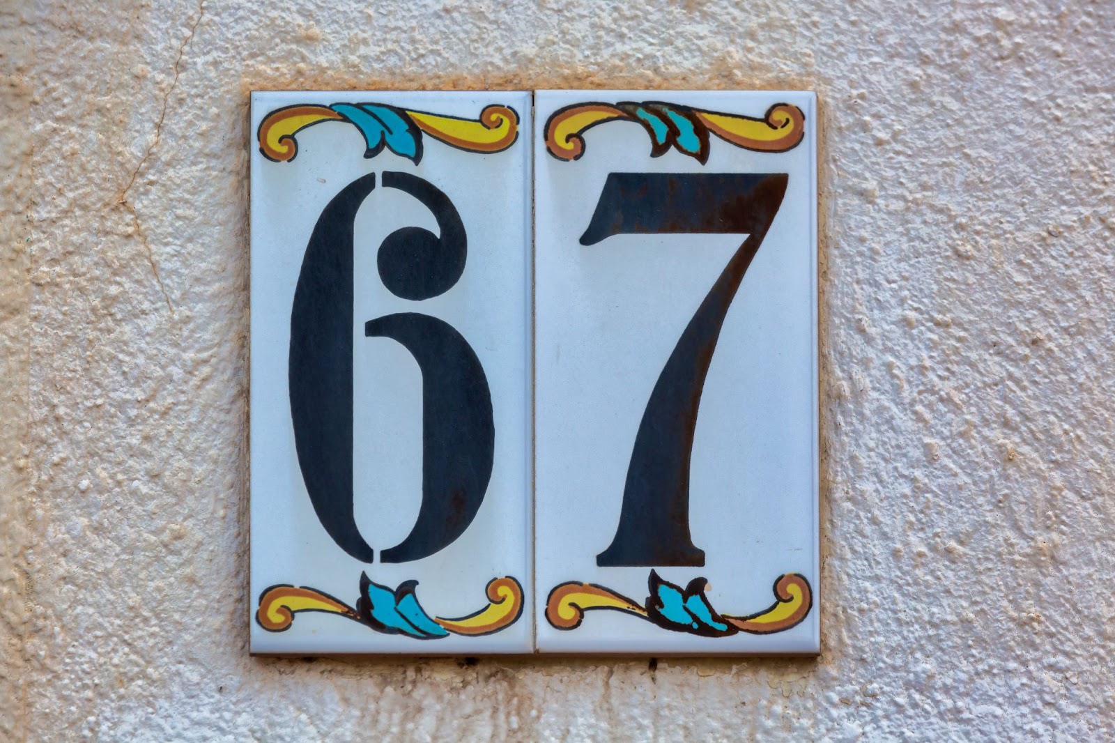 Number 67 white, yellow and blue vintage tile.