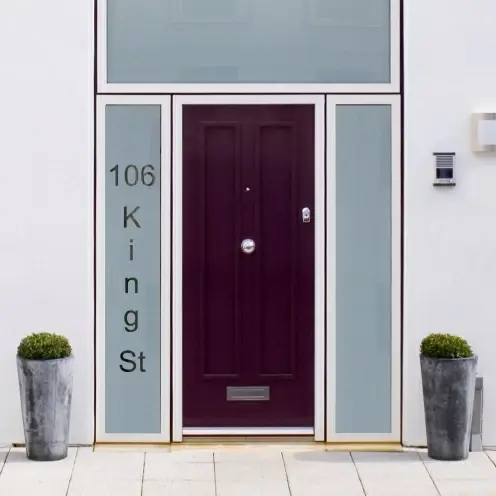 Door with the house number on the glass panel next to it.